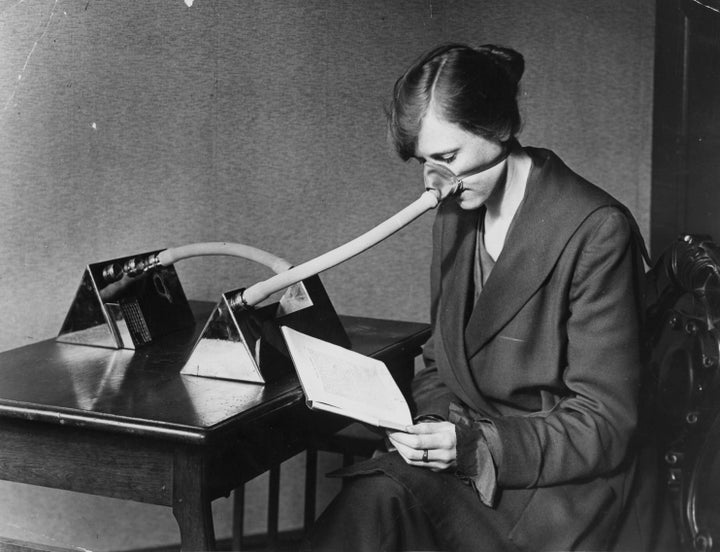 A woman wearing a flu mask during the flu epidemic which followed the First World War, 1919.