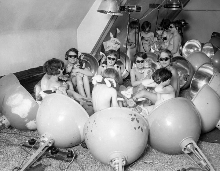 Children using a light bath in Berlin, Germany circa 1929.