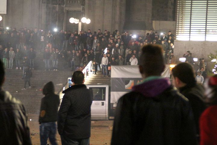 People gathering in front of the station on New Year's Eve.