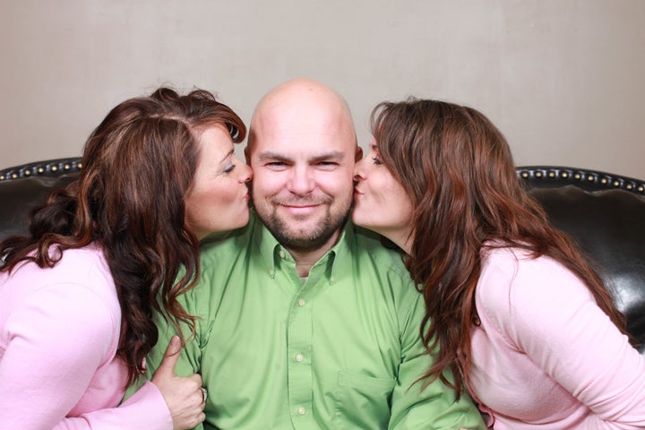 Twin sisters Vicki and Valerie Darger, seen here in March 2012, are so close they even share their husband. OkCupid is making it easier for people like them to find mates.