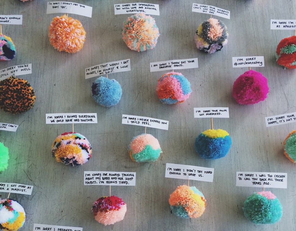 Each plush, handmade pom pom carries an anonymous apology, from "I'm sorry I cheated on you" to "I’m sorry I’ve s
