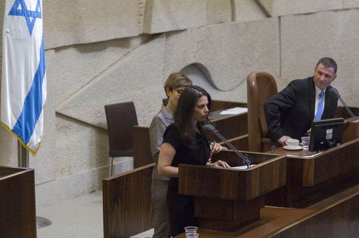 Ayelet Shaked, Israel's Justice Minister, seen here speaking on the Knesset floor, has introduced a controversial bill that would require greater regulation of foreign-funded NGOs.