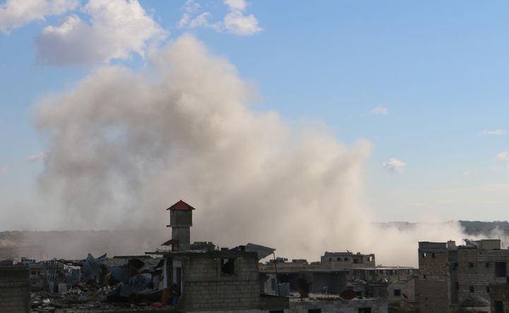 Smoke rises as Russian warplanes conduct air strikes targeting opposition controlled prison at opposition controlled Maret el Numan district of Idlib, Syria on January 9, 2016.