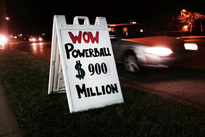 A sign outside of a Connecticut gas station displays Saturday night's potential winnings in the Powerball lottery