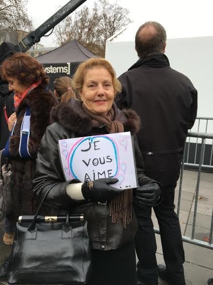 Another display of love at Sunday's commemorative event. "I love you," one woman's sign said.