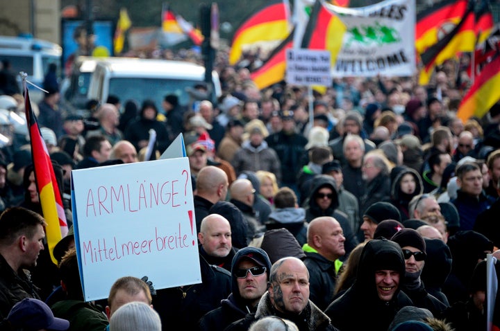 Members of far-right populist group Pegida march in protest. Cologne police received hundreds of complaints of sexual violence and robbery related to gangs of men on New Year's Eve.