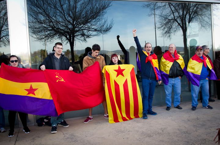 Urdangarin, the princess' husband, is accused of using his royal connections to win public contracts to put on events through the charity. People display Republican flags and a Catalan independence flag protest outside the courtroom in Palma de Mallorca.
