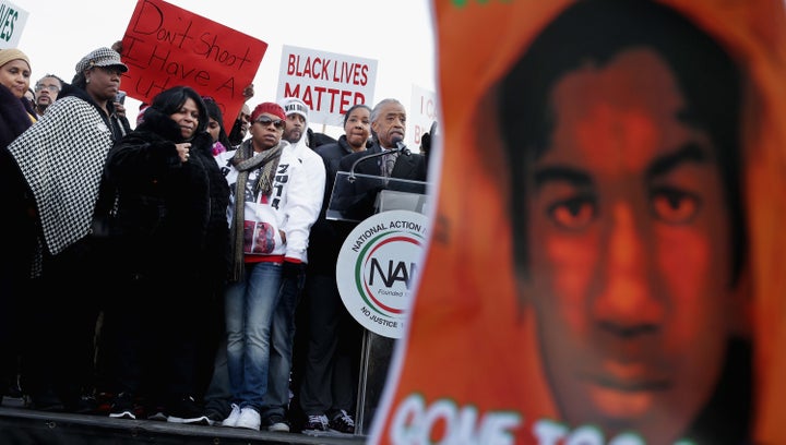 Sybrina Fulton (second from left) and other relatives of victims of gun violence and police abuse rally in the nation's capital in December 2014, calling for systemic change, accountability and justice in cases of police misconduct.