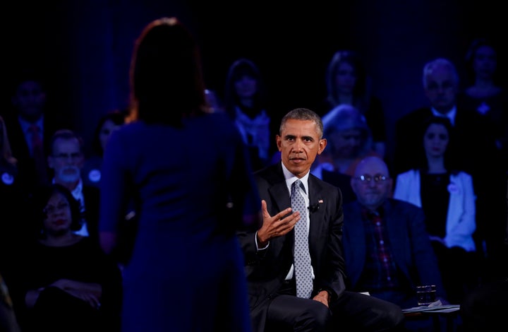 President Barack Obama answers a question at town hall at George Mason University on January 7, 2016 in Fairfax, Virginia. Hi