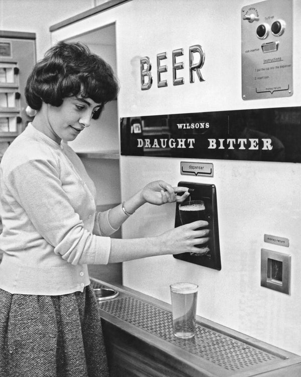 A Woman Getting Pint Of Draught Bitter From Vending Machine Circa 1960s A Woman Getting Pint Of Draught Bitter From Vending Machine Circa 1960s