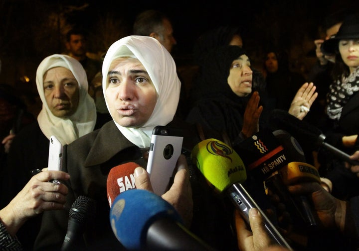 Syrian women speak to the press on the outskirts of the besieged rebel-held Syrian town of Madaya, on January 11, 2016, after