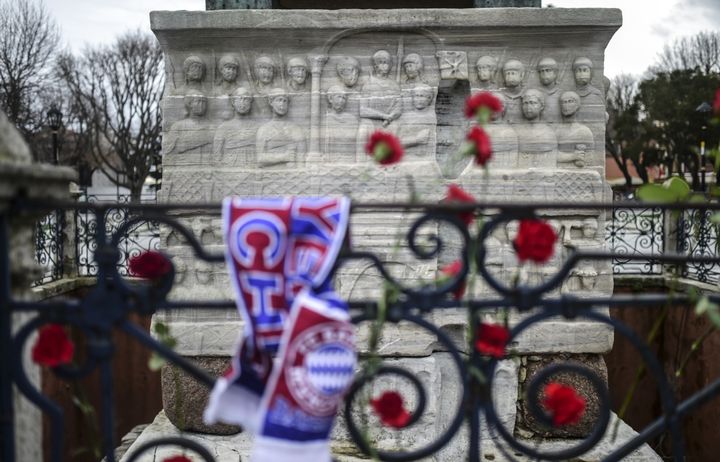 The bomber, believed to be an Islamic State militant from Syria, had registered at an immigration office in Istanbul a week ago. People leave flowers and a scarf of German football team Bayern Munchen at the site of the attack in tribute to the victims.