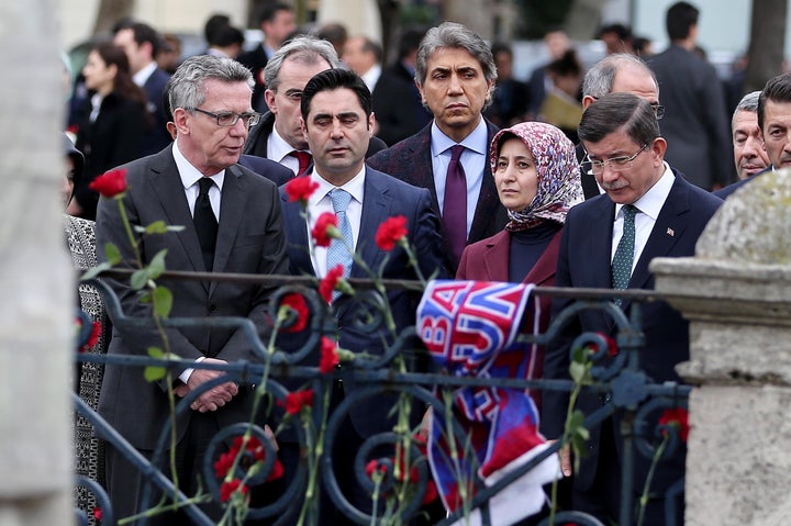 Turkish Prime Minister Davutoglu mourns at the location of a terror attack that killed at least 10 in Istanbul on Tuesday. The bombing seemed to be aimed at killing tourists.