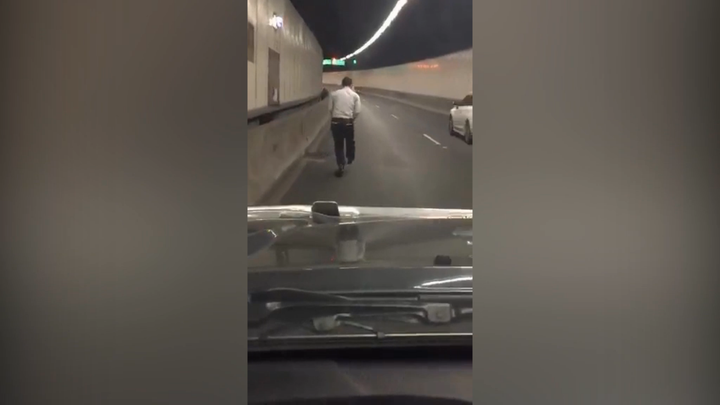 Police say this 42-year-old man was fined for riding a children's push scooter through a busy Sydney tunnel on Tuesday.
