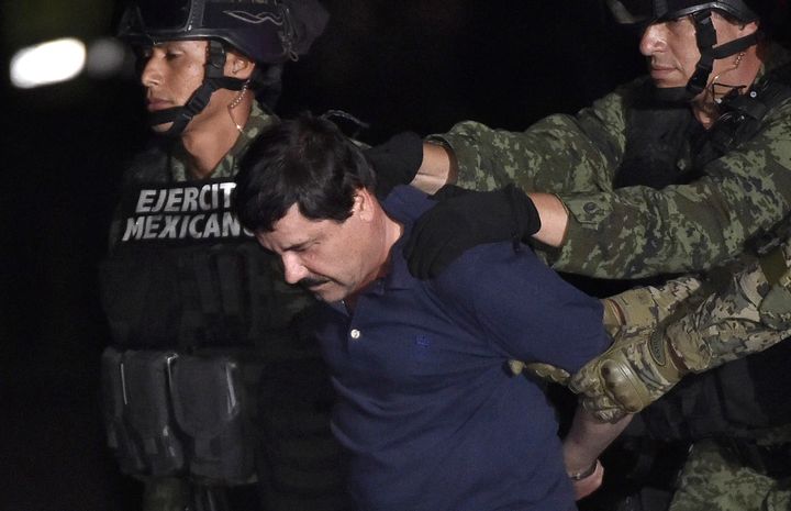 Drug kingpin "El Chapo" Guzmán is escorted into a helicopter in Mexico City airport on Jan. 8 after authorities captured him. He has broken out of prison twice. 