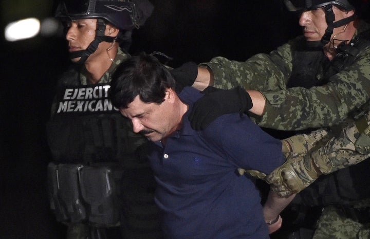 Drug kingpin "El Chapo" Guzmán is escorted into a helicopter in Mexico City airport on Jan. 8 after authorities captured him. He has broken out of prison twice.