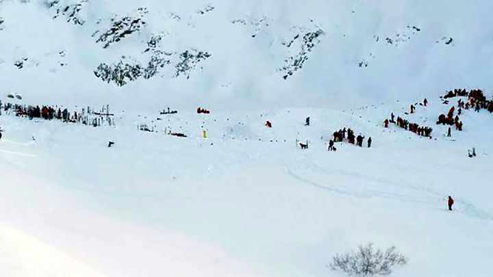 At least three people are reported killed in an avalanche in the mountain range. Teams gather for search and rescue operations at the avalanche site.