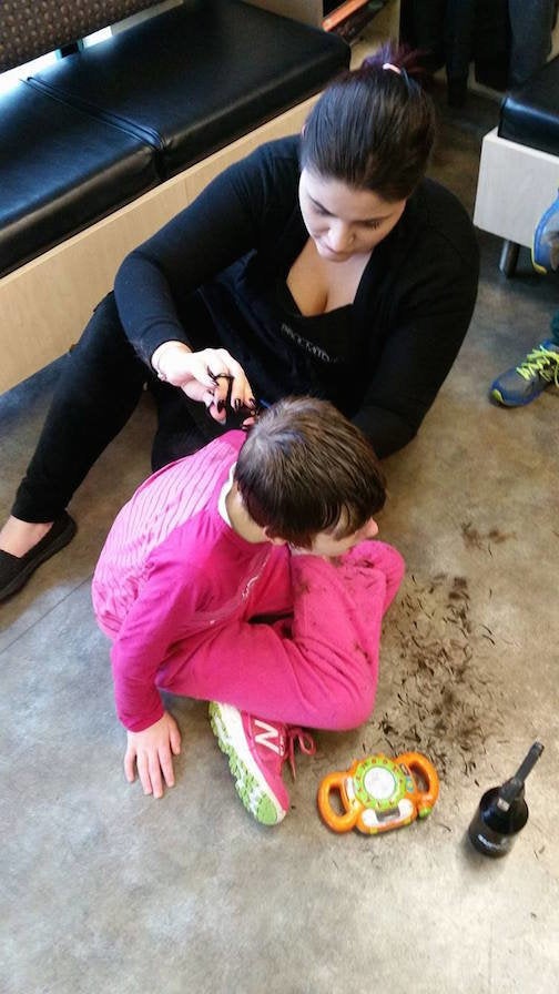 Julia Werder giving Madysen a haircut at Supercuts.