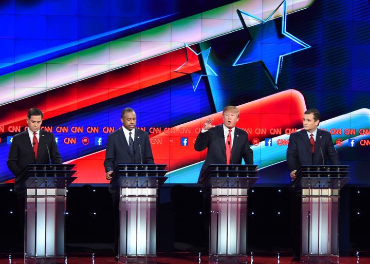 Donald Trump with a high-energy gesture at the last Republican debate in Las Vegas.