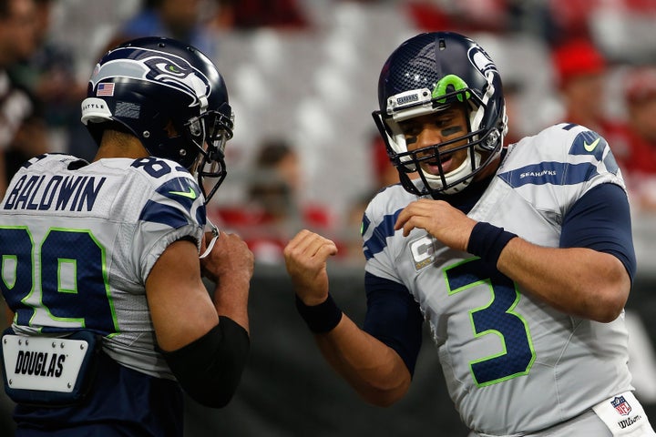 Russell Wilson (right) has tossed 15 touchdown passes to Doug Baldwin this season. Baldwin's 15 TDs are the most by any recei