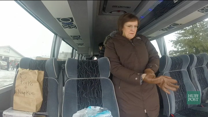 Karen Tumulty, a national correspondent with The Washington Post, bundles up before getting off the media bus to cover a Ted
