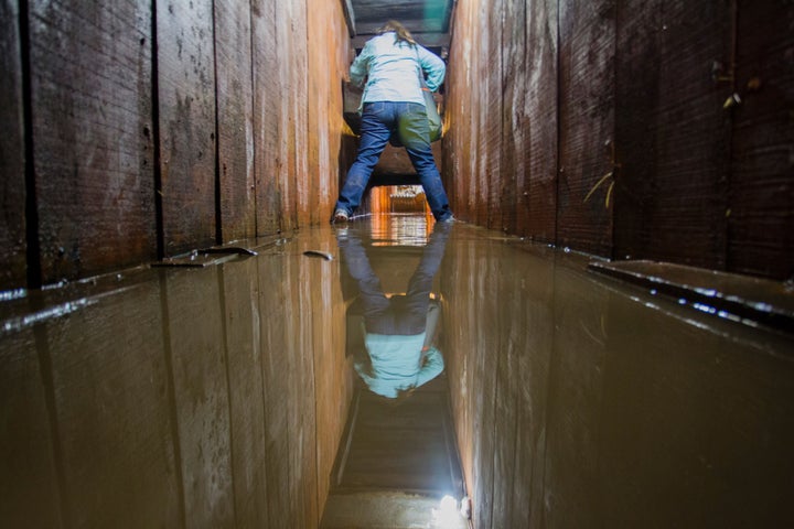 A journalist walks through the tunnel Guzmán used last July to escape from prison. The drug lord's riva