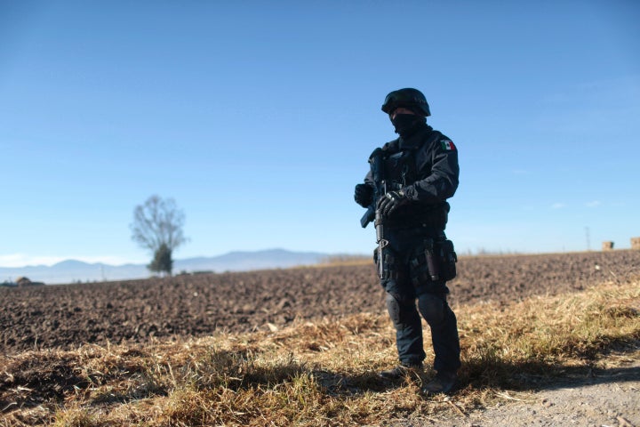 A Mexican federal police officer stands guard near the prison where Guzmán was readmitted on Jan. 9, 20
