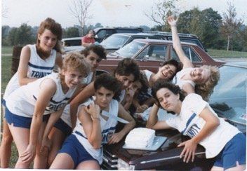 Anastasia and friends at a track meet around the time of her parents' divorce.