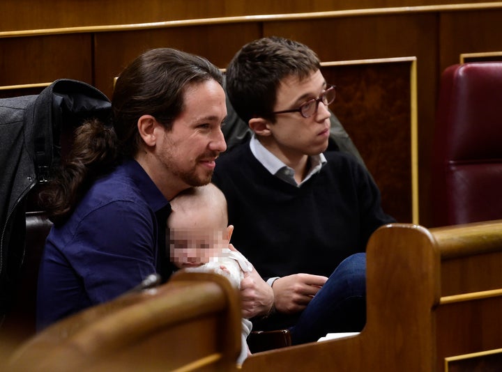 Podemos' leader Pablo Iglesias snuggles with Diego, whose face Bescansa asked not be photographed. 