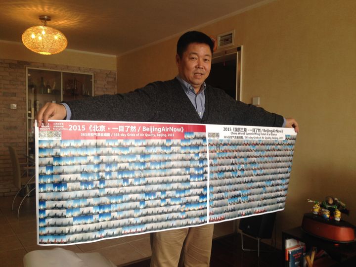 Zou holds up collages of his photos at his home in Beijing.