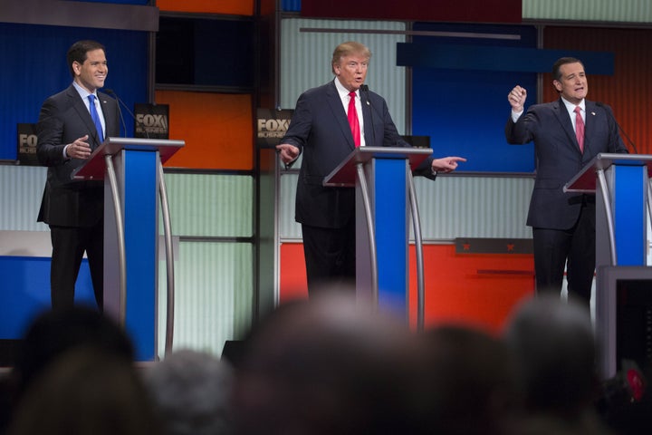 2016 Republican presidential candidates, from left, Senator Marco Rubio, a Republican from Florida, Donald Trump, president and chief executive of Trump Organization Inc., and Senator Ted Cruz, a Republican from Texas, talk during the Republican presidential candidate debate at the North Charleston Coliseum in North Charleston, South Carolina, U.S., on Thursday, Jan. 14, 2016.