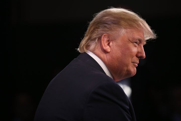 Republican presidential candidate Donald Trump speaks to the media in the spin room after the Fox Business Network Republican presidential debate at the North Charleston Coliseum and Performing Arts Center on January 14, 2016 in North Charleston, South Carolina.