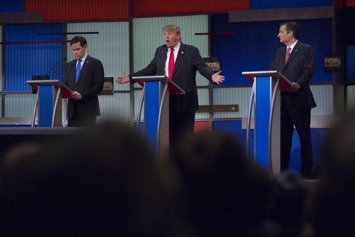 Donald Trump, president and chief executive of Trump Organization Inc. and 2016 Republican presidential candidate, center, speaks as 2016 Republican presidential candidates Senator Marco Rubio, a Republican from Florida, left, and Senator Ted Cruz, a Republican from Texas, listen during the Republican presidential candidate debate at the North Charleston Coliseum in North Charleston, South Carolina, U.S., on Thursday, Jan. 14, 2016.