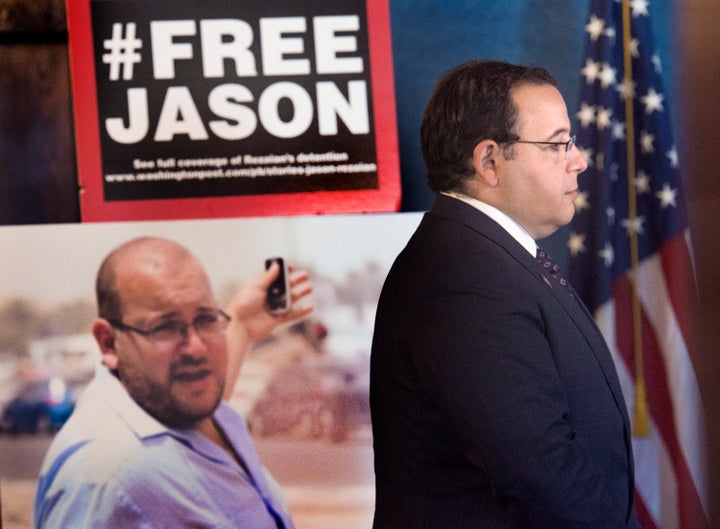 Ali Rezaian, the brother of imprisoned Washington Post journalist Jason Rezaian (shown in the poster), gives reporters an update on his brother's case at the National Press Club in Washington, D.C., on July 22, 2015. Rezaian is one of four Americans expected to be freed Saturday as part of a deal with Iran.