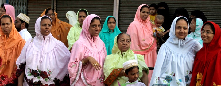 Dawoodi Bohra Muslim women watch a procession to mark the birthday of their spiritual leader in Ahmadabad, India, in 2010. In