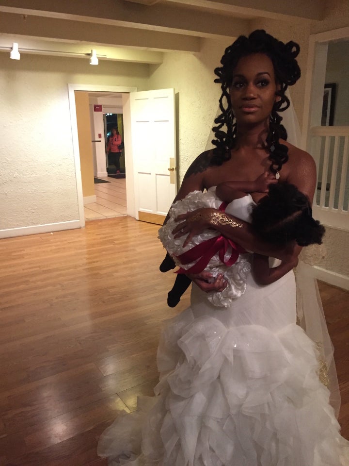 Brandi Chantalle breastfeeding Zora on her wedding day. 