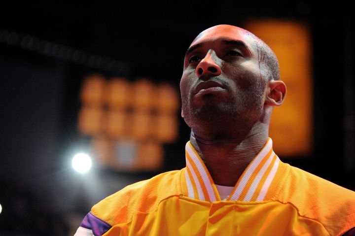 Kobe Bryant stands for the national anthem before a game against the Miami Heat on Jan. 13, 2015, in Los Angeles, California.