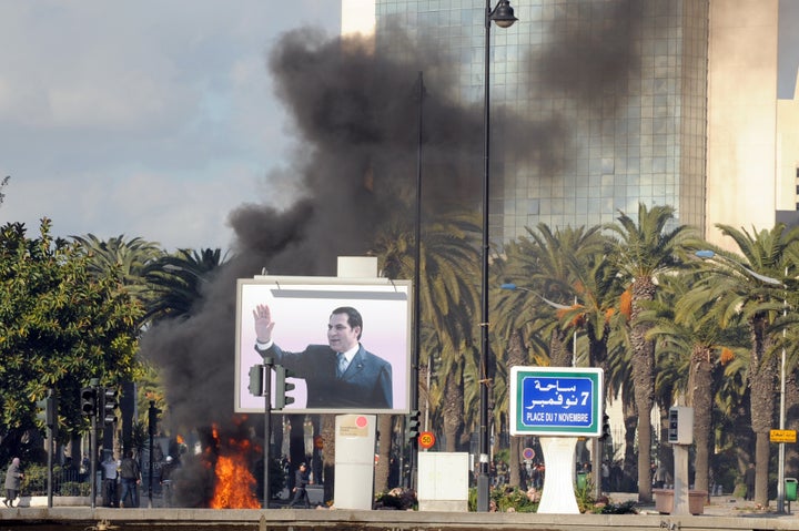 Smoke rises from fire left after clashes between security forces and demonstrators in Tunis on Jan. 14, 2011.