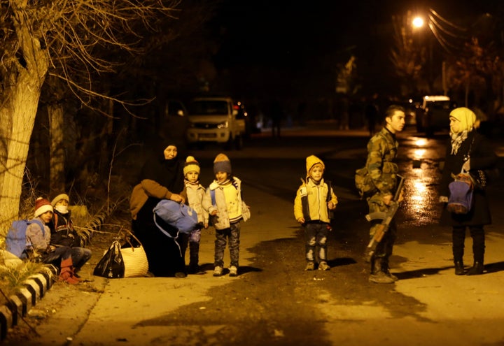 Women and children wait on the outskirts of rebel-held Madaya after being evacuated from the town on Jan. 11. The Syria Campaign director James Sadri told Syria Deeply told Syria Deeply that the UN is failing to end the widespread use of siege tactics in Syria. 