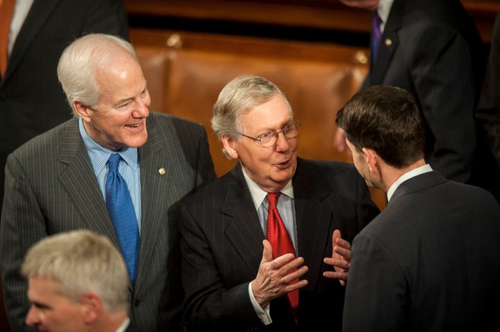 Senate Majority Leader Mitch McConnell, a Republican from Kentucky, center, speaks with Representative Paul Ryan, a Republican from Wisconsin, right, as Senator John Cornyn, a Republican from Texas, looks on before U.S. President Barack Obama delivers the State of the Union address to a joint session of Congress at the Capitol on Jan. 20, 2015.