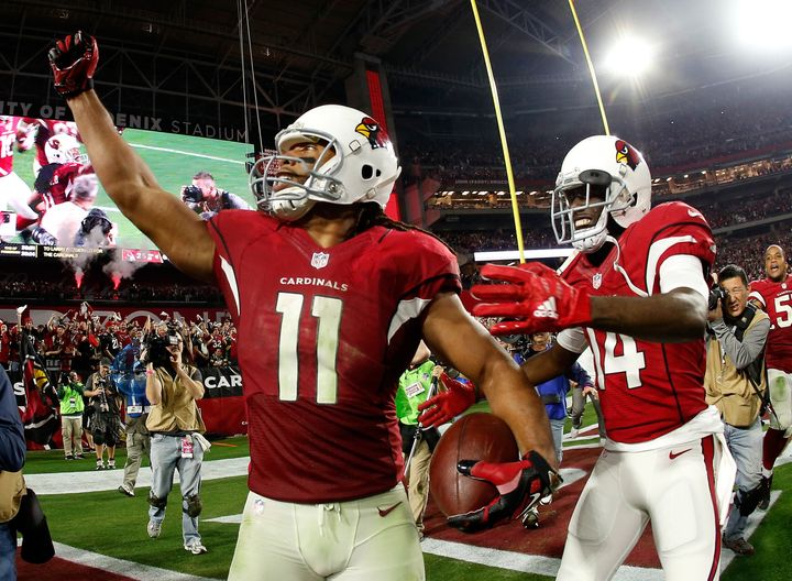 Wide receiver Larry Fitzgeraldcelebrates his game-winning touchdown right after the NFC Divisional Playoff Game at University of Phoenix Stadium on Jan. 16, 2016. 