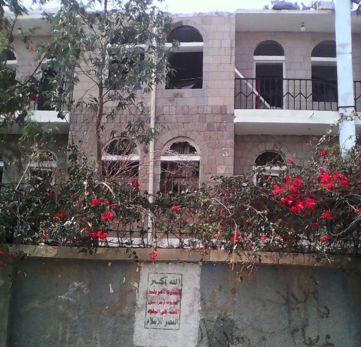 Houthi graffiti appears on the wall of the compound housing the al-Noor Center.