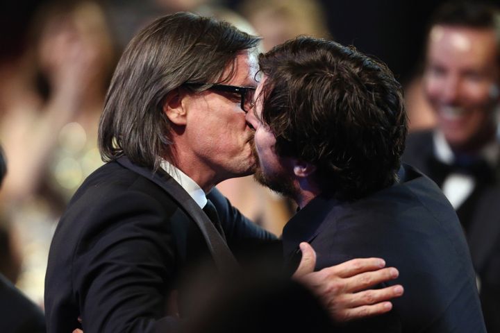 Christian Bale and screenwriter Charles Randolph kiss onstage during the 21st Annual Critics' Choice Awards on Jan. 17, 2016 in Santa Monica, California. 