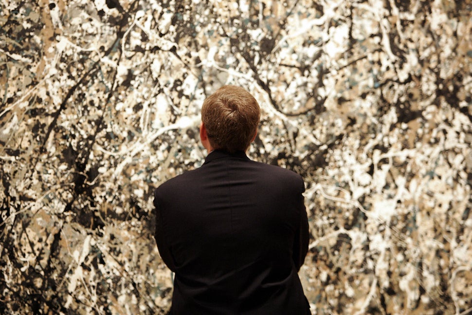 French Culture Minister Renaud Donnedieu de Vabres looks at a painting by Jackson Pollock at the Museum of Modern Art (MOMA)