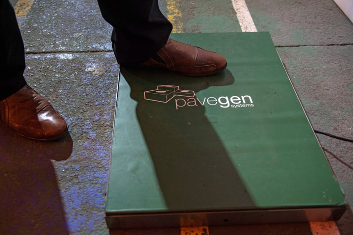 A man steps on one of Pavegen's electricity-generating tiles.