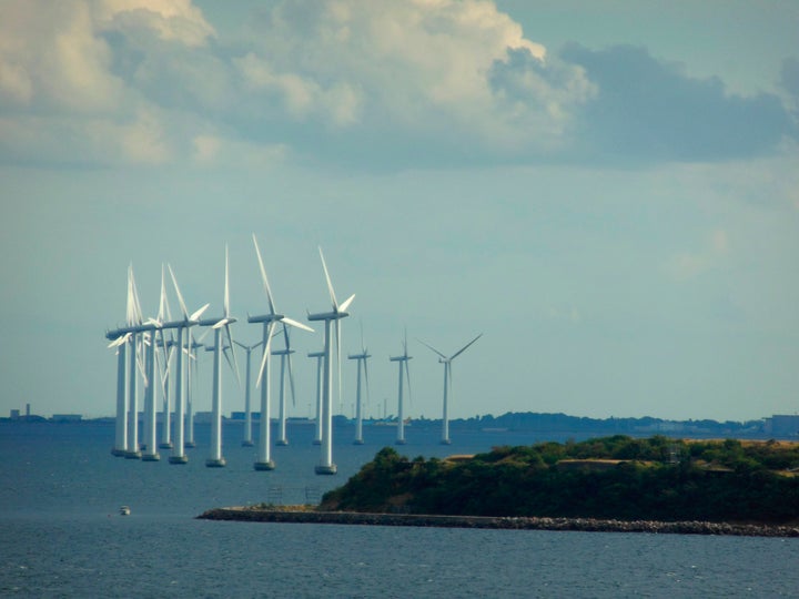 Wind turbines spin in Copenhagen. Denmark relies heavily on wind power.