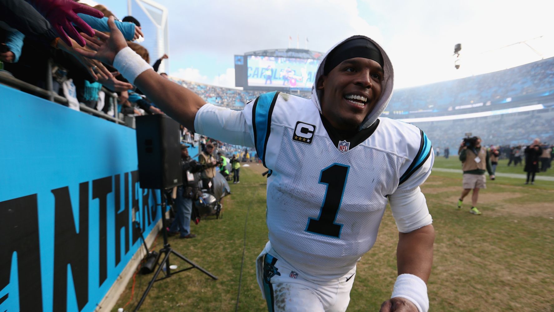 Carolina Panthers' Cam Newton (1) applauds after a play during the