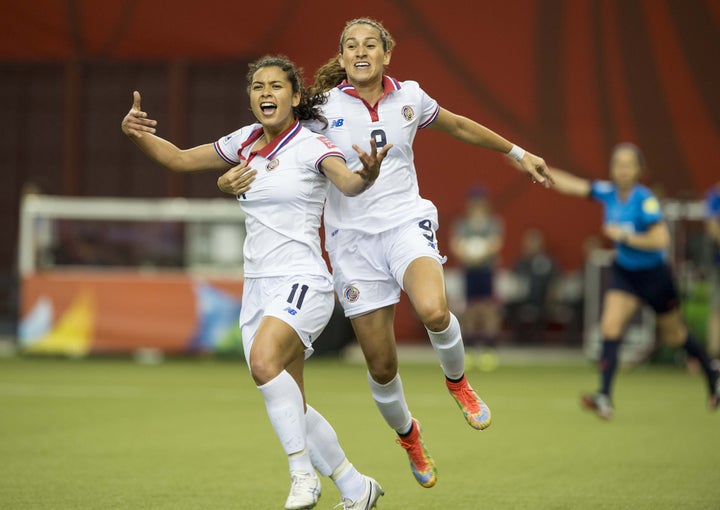 Raquel Rodriguez (left) celebrates after scoring Costa Rica's first-ever Women's World Cup goal during a match against Spain in 2015.