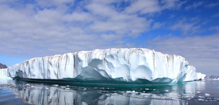 Clouds float above the east Greenland ice sheet and glaciers.