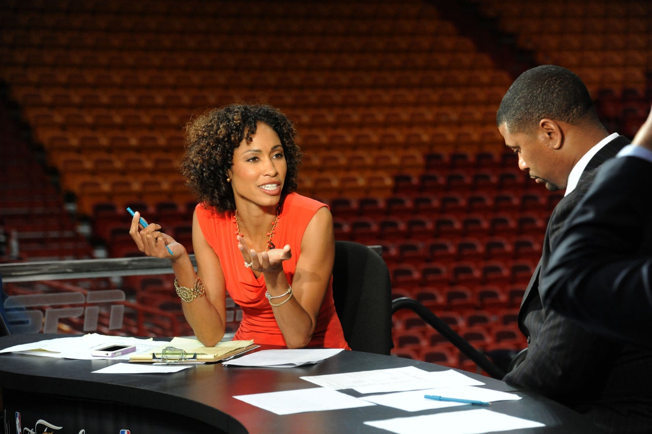 Steele speaks with Jalen Rose while preparing for a 2012 NBA Finals game at American Airlines Arena in Miami, Florida.